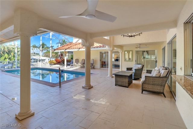 view of pool with ceiling fan, a lanai, an outdoor hangout area, and a patio