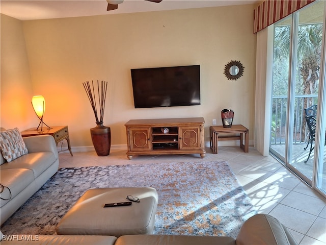 tiled living room with ceiling fan