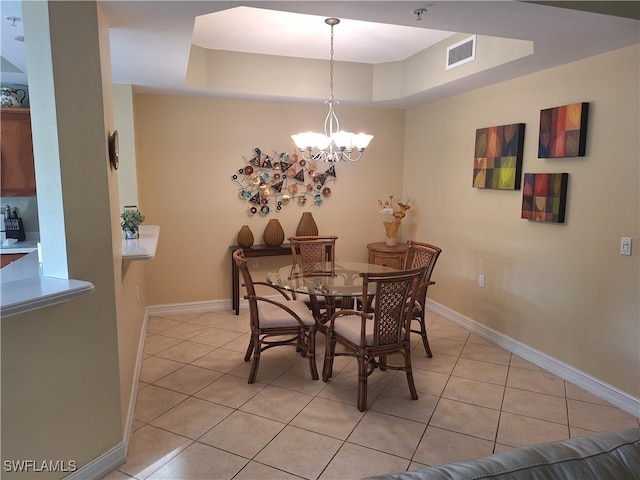 dining room with light tile patterned flooring and an inviting chandelier