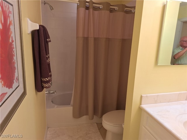 full bathroom featuring toilet, vanity, tile patterned floors, and shower / bathtub combination with curtain