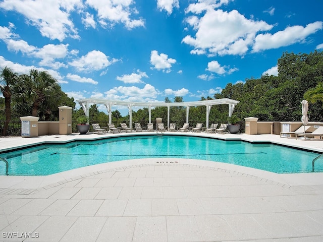 view of pool featuring a pergola and a patio