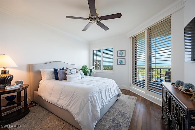 bedroom featuring ceiling fan, crown molding, and dark hardwood / wood-style floors
