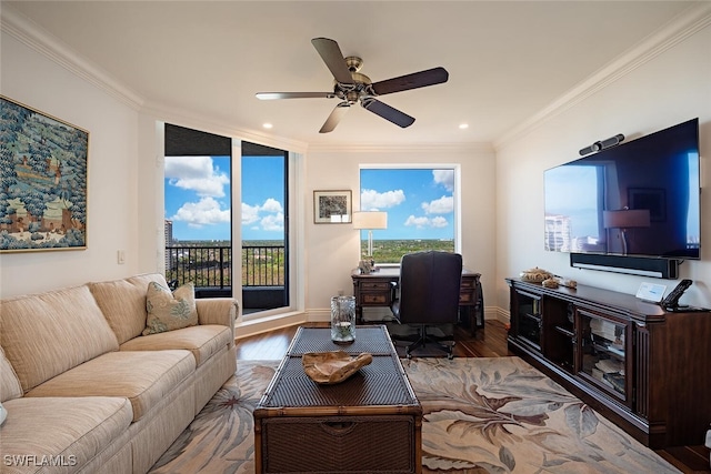 living room featuring crown molding, ceiling fan, and hardwood / wood-style flooring