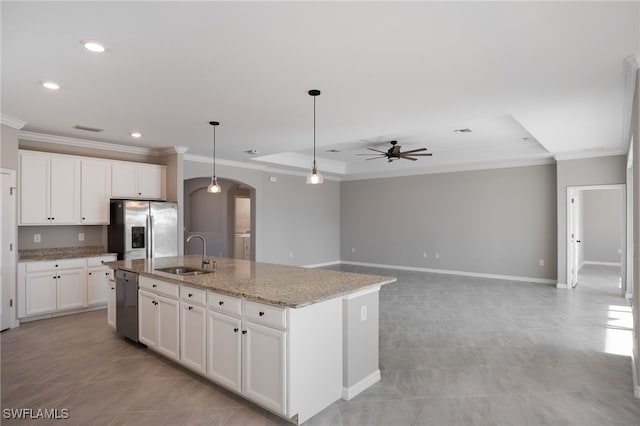 kitchen with a kitchen island with sink, sink, white cabinets, and stainless steel appliances