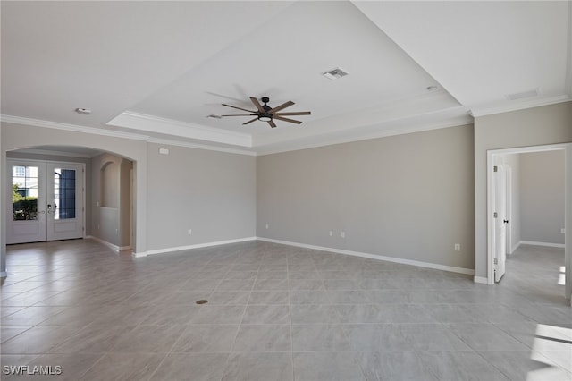 unfurnished living room with french doors, a tray ceiling, ceiling fan, and crown molding