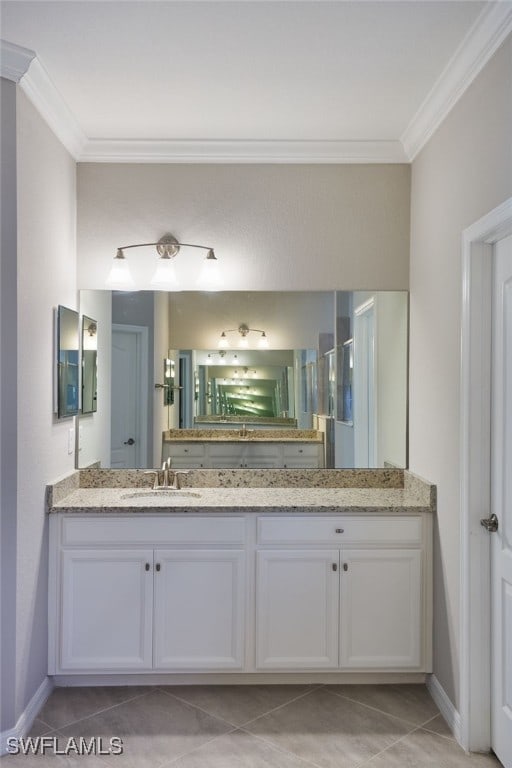 bathroom featuring vanity, tile patterned floors, and crown molding