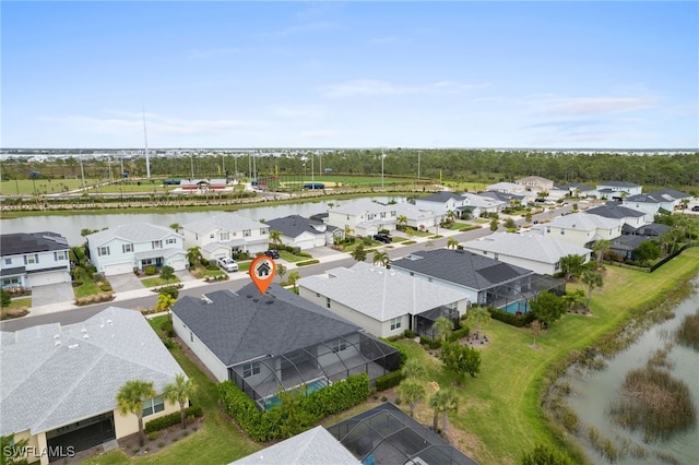 birds eye view of property featuring a water view