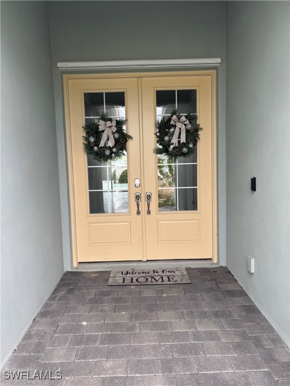 view of exterior entry featuring french doors