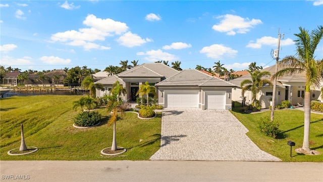 ranch-style home with a front lawn and a garage