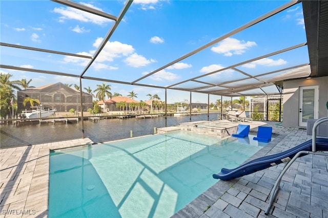 view of swimming pool featuring a lanai, a water view, and a patio