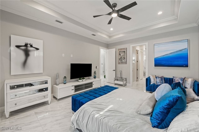 bedroom featuring ceiling fan, ornamental molding, and a tray ceiling