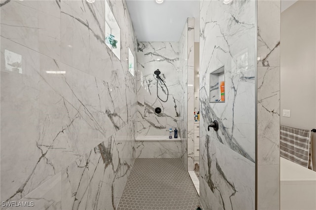 bathroom with a tile shower