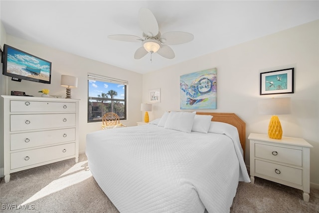 bedroom featuring ceiling fan and light carpet