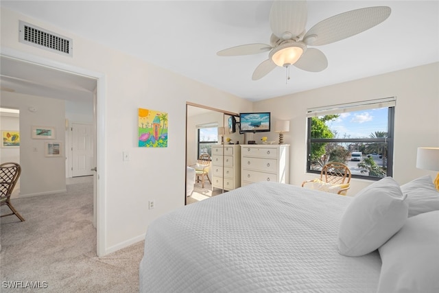 bedroom featuring ceiling fan and light colored carpet