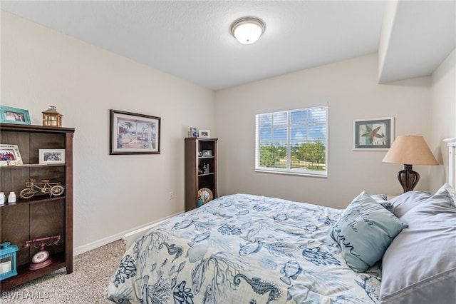 bedroom featuring light carpet