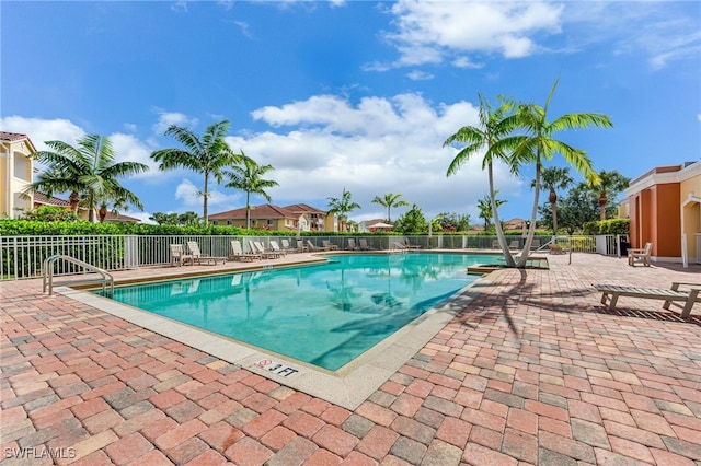 view of swimming pool featuring a patio area