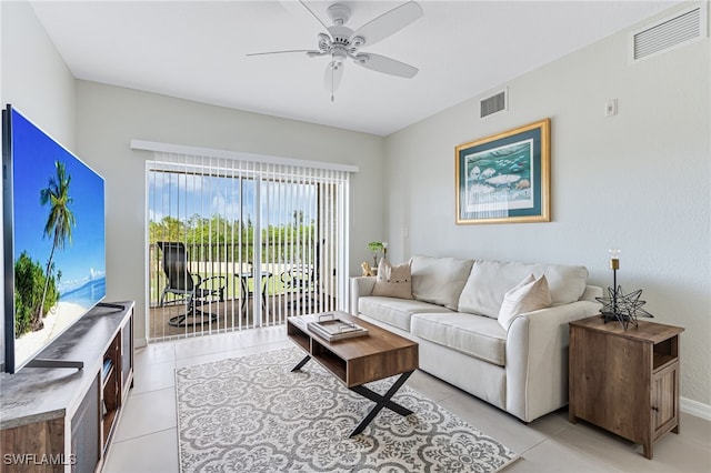 living room featuring ceiling fan and light tile patterned floors