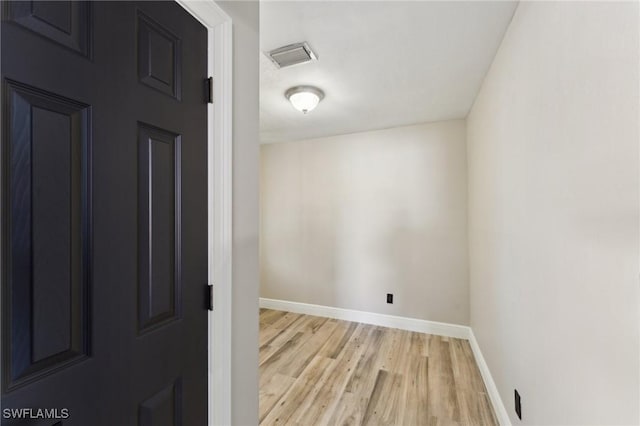 unfurnished room with light hardwood / wood-style flooring