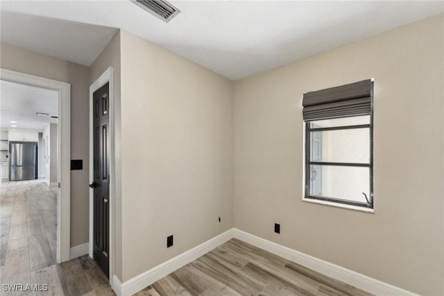 empty room featuring light hardwood / wood-style floors