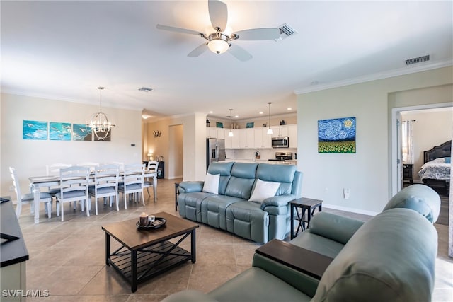 tiled living room featuring ceiling fan with notable chandelier and ornamental molding