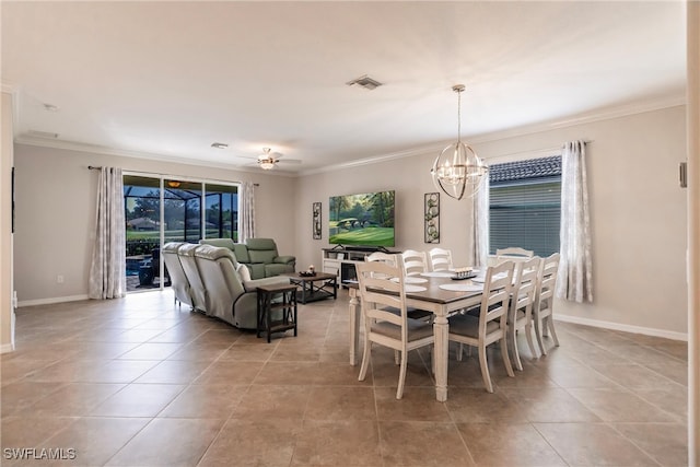 dining room featuring crown molding, light tile patterned floors, and ceiling fan with notable chandelier