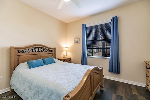 bedroom featuring ceiling fan and dark wood-type flooring