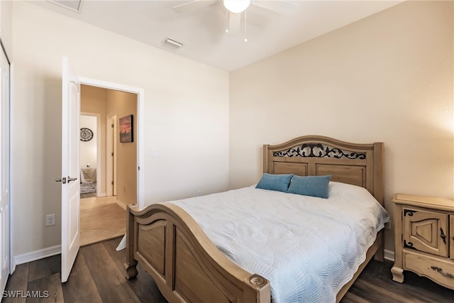 bedroom with ceiling fan and dark wood-type flooring