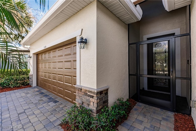 doorway to property featuring a garage