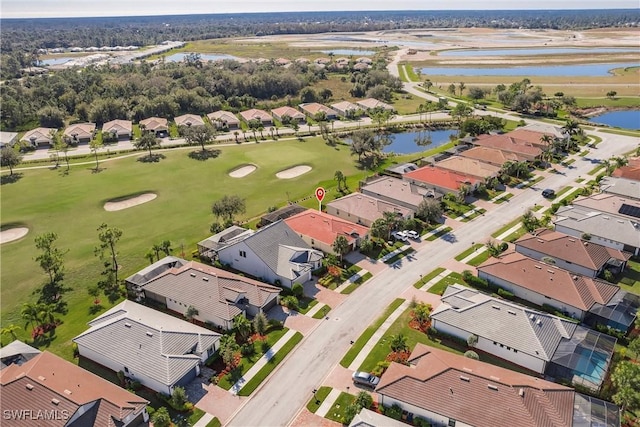 bird's eye view featuring a residential view, a water view, and golf course view