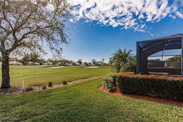 view of yard featuring a lanai