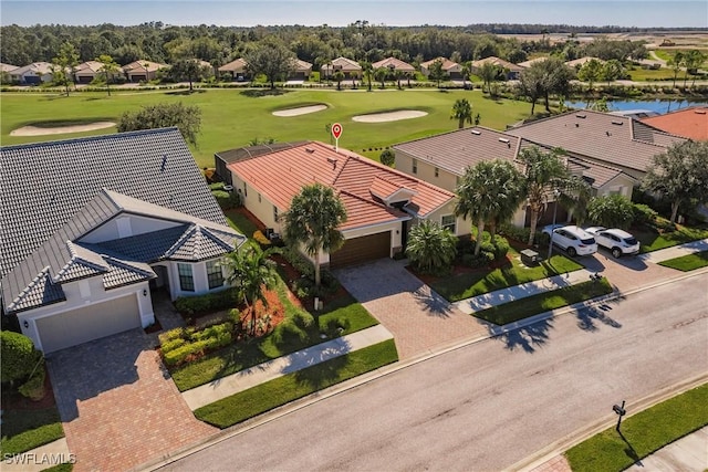 bird's eye view featuring a water view, a residential view, and golf course view