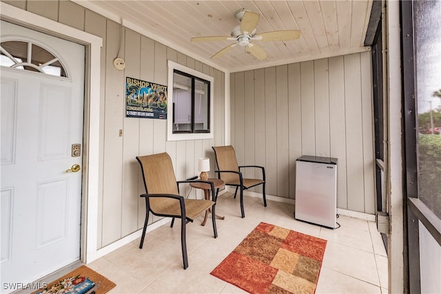 exterior space with ceiling fan and wood ceiling