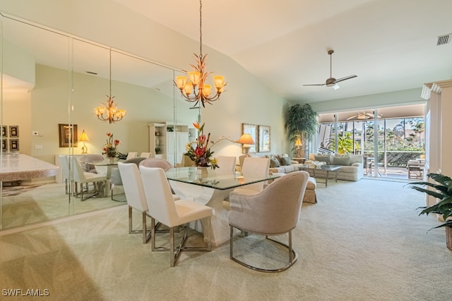 dining area featuring light carpet, ceiling fan with notable chandelier, and high vaulted ceiling