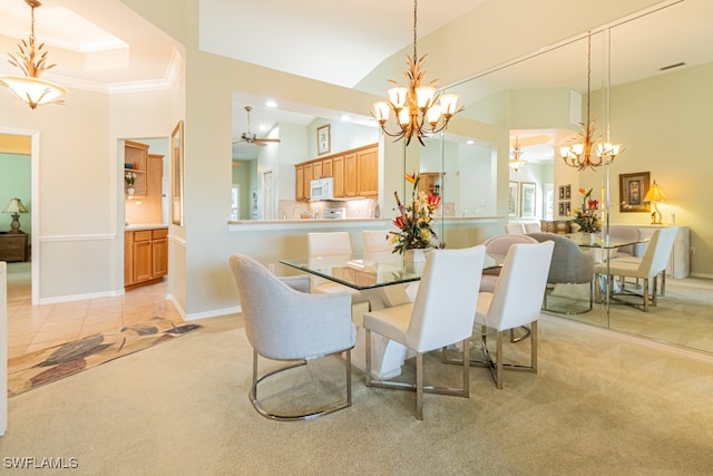 dining space with high vaulted ceiling, light colored carpet, and ornamental molding