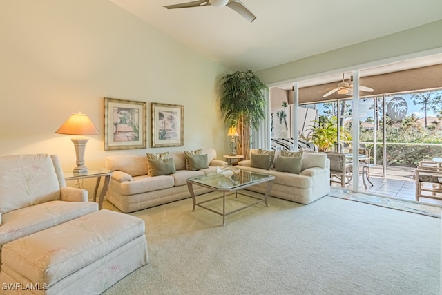 carpeted living room featuring ceiling fan and vaulted ceiling