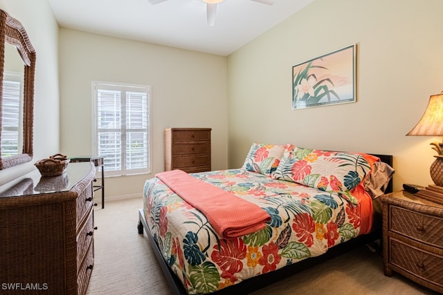 carpeted bedroom featuring ceiling fan