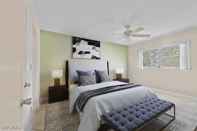 tiled bedroom featuring ceiling fan