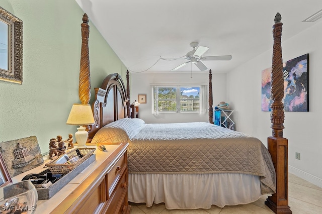 bedroom with ceiling fan and light tile patterned floors