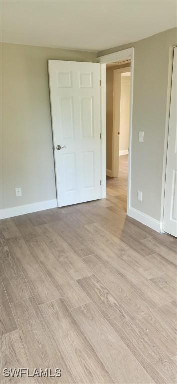 unfurnished bedroom featuring light wood-type flooring