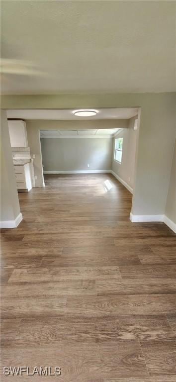 empty room with wood-type flooring