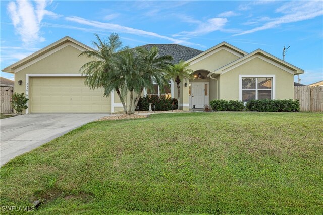 ranch-style house with driveway, fence, a front lawn, and stucco siding