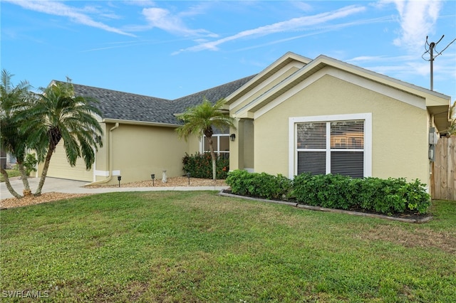 3530 NE 12th Ct, Cape Coral, FL 33909 - single story home with an attached garage, stucco siding, driveway, and roof with shingles
