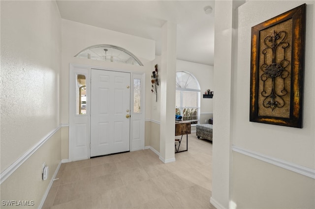 foyer entrance with baseboards