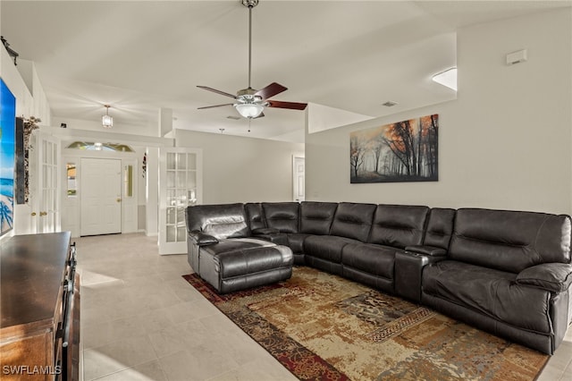 living room featuring lofted ceiling, visible vents, a ceiling fan, and french doors