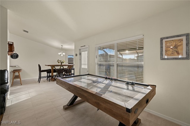 rec room featuring light tile patterned floors, visible vents, and baseboards