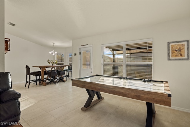 3530 NE 12th Ct, Cape Coral, FL 33909 - rec room with a chandelier and baseboards