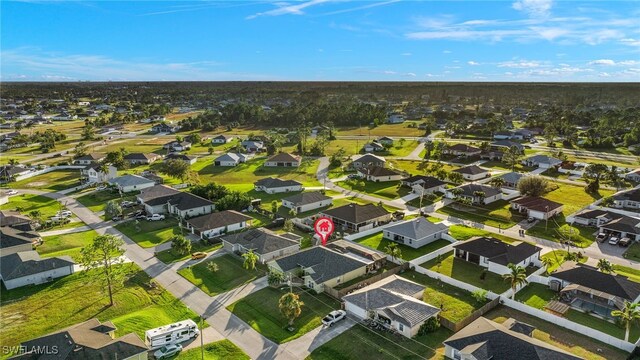 birds eye view of property with a residential view