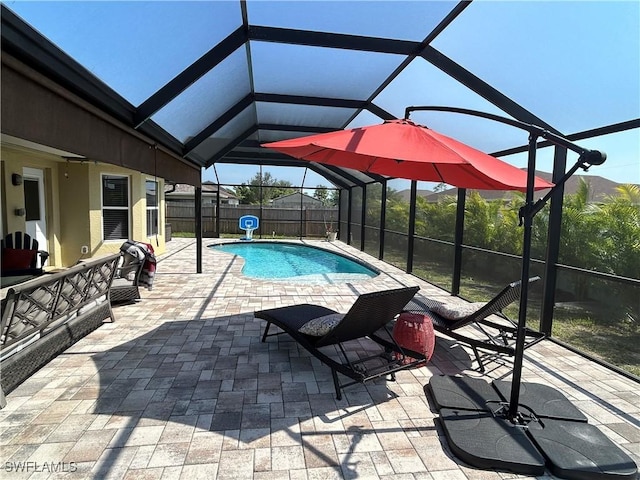 3530 NE 12th Ct, Cape Coral, FL 33909 - view of swimming pool featuring a lanai, a patio, and a fenced backyard