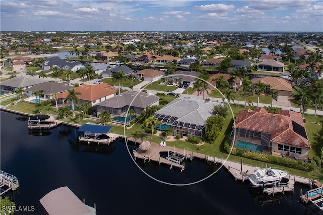 bird's eye view with a water view