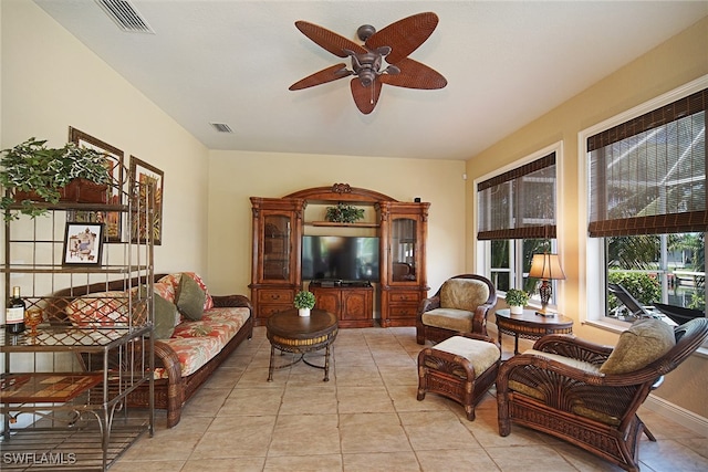 living room featuring ceiling fan and light tile patterned flooring